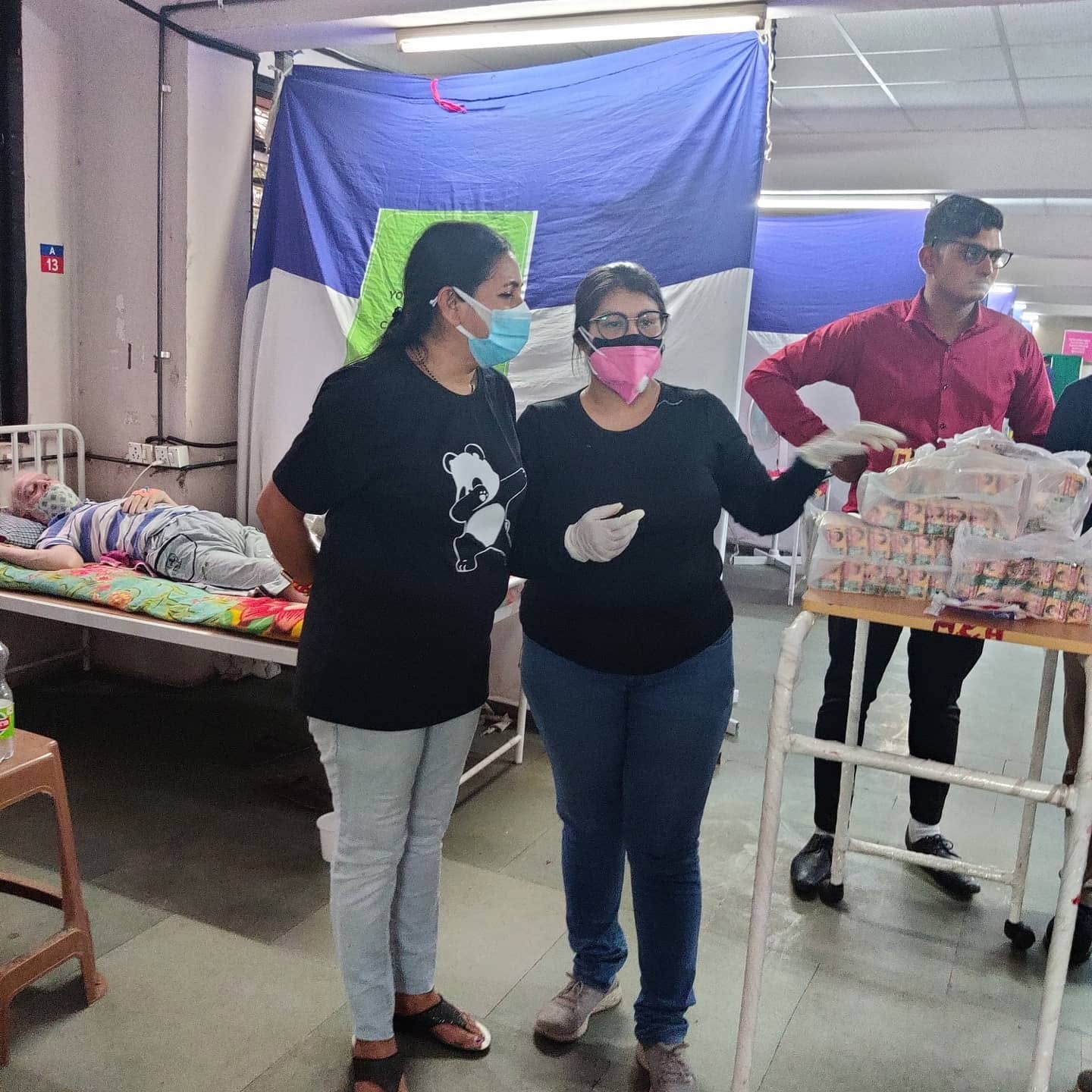 Volunteers assisting patients in a COVID care ward